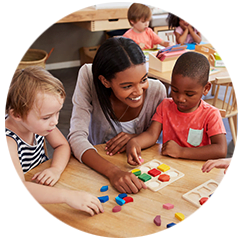 Toddler child care program near me | Building Blocks Teacher & Kid Playing